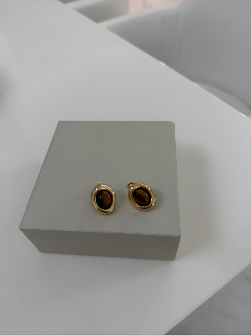 Gold-Tone Stud Earrings with cat eye stone.